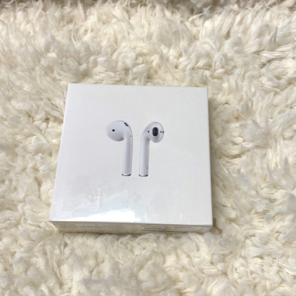 AirPods with charging case.  Unopened packaging.